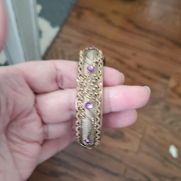 Gold tone Intricate bracelet w/ raised pattern with amethyst cor stones on Hinge - Picture 5 of 5